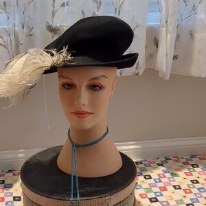 Chic Black Hat with Feather Detail